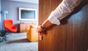 Hotel worker opening room door