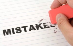 someone using an eraser to erase the word 
