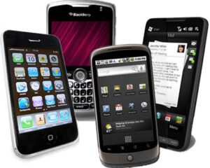 photo of four older smart phones opened to messages and home screens