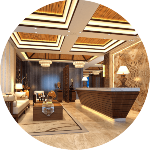 warmly colored hotel lobby with tan tiled floors, wood accents on the furniture and hotel desk, wood paneled ceiling