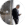 man with grey hair and a beard and glasses in a suit looking down at a smartphone with headphones in, standing near a hotel front desk